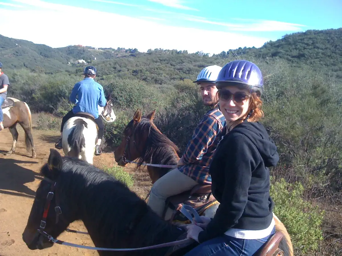Riders turning back to smile on the trail