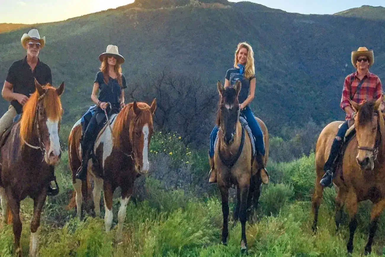 Five riders at golden hour in the green hills